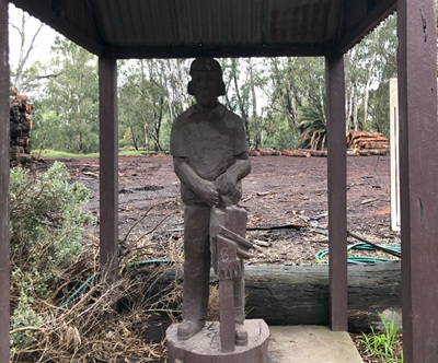 Sculpture of Man and Chainsaw